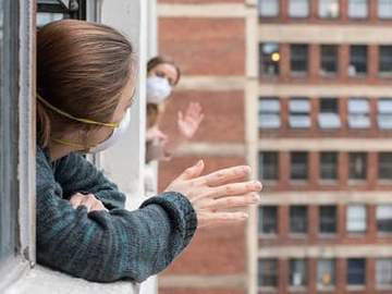 neighbors waving to each other from windows